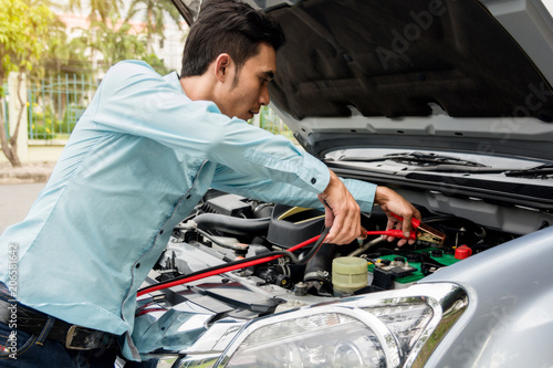 Driver's auto repair can start with server and batter on road.