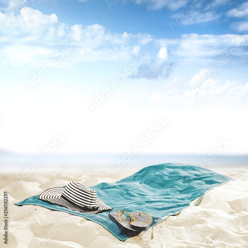 Fototapeta Naklejka Na Ścianę i Meble -  towel on beach and free space for your decoration. 