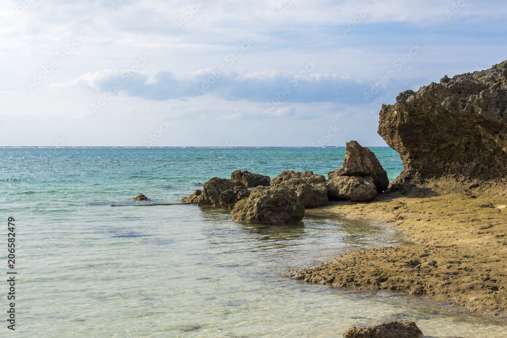 Beautiful ocean coast and rocks view from beach, Okinawa Japan.
