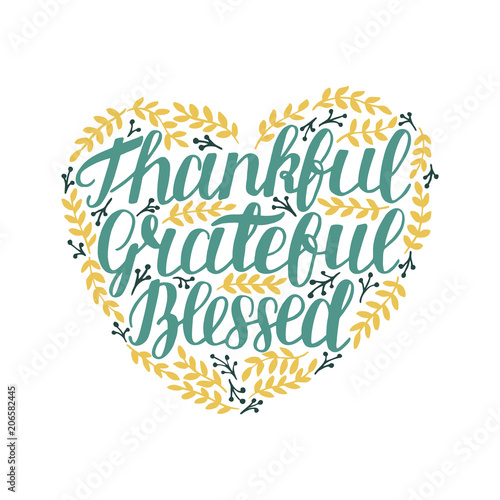 Hand lettering Thankful, grateful, blessed in shape of heart with leaves