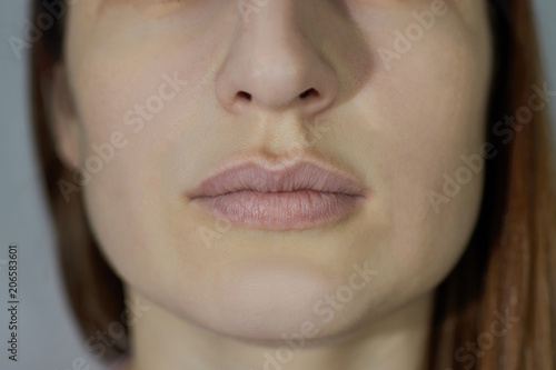 clean lips of the girl without makeup and tattoo