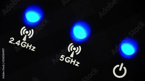 Blinking LEDs on a modern wireless router with 2.4 GHz and 5 GHz bands