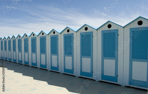 wooden beach cabins by the sea, changing rooms, blue and white, used to change and put on bathing suit, vacation, summer, sun, ligurian riviera, Albenga beach, Italy
