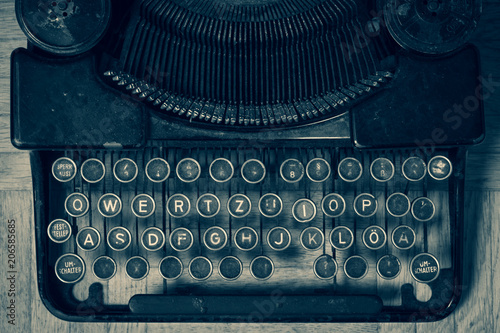 Dirty vintage typewriter keyboard in German