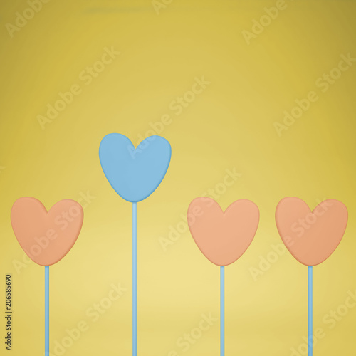 Minimal love and care concept idea, blue and orange heart shape candies on yellow pastel background with copy space
