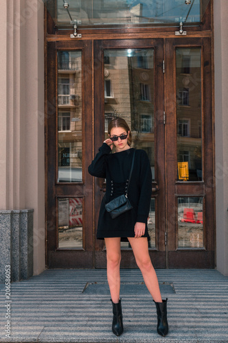 Stylish and fashionable girl with glasses on the city street © alexbutko_com