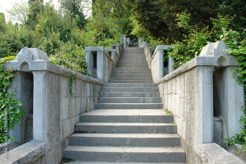 Long stone staircase leading to the distance in the old Park