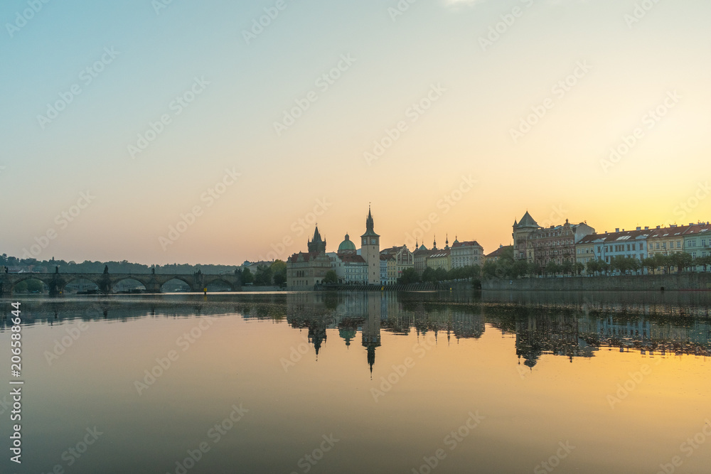 Prague, Charles Bridge and the old building by the River in the morning