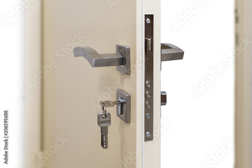 Open armored door. Door lock, metal door. Modern interior design, door handle. New house concept. Real estate. photo