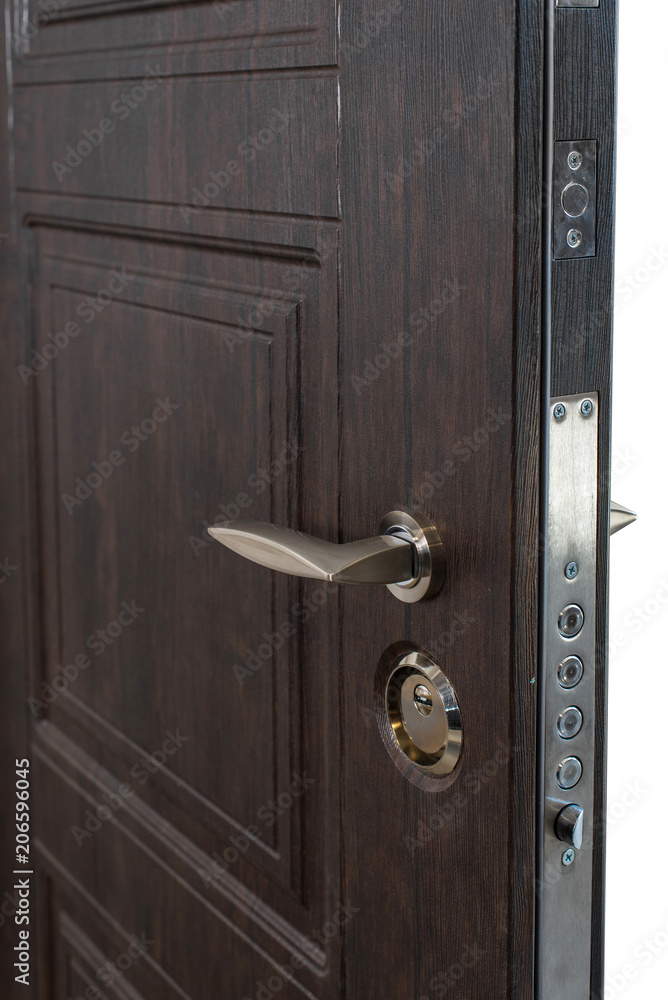 Obraz premium Open door. Door lock, Dark brown door closeup. Modern interior design, door handle. New house concept. Real estate.