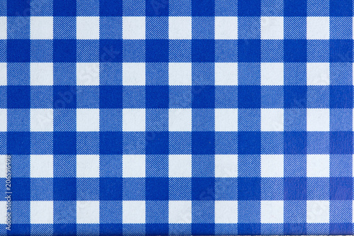 A dark blue gingham fabric background that is seamless © bumbumbo