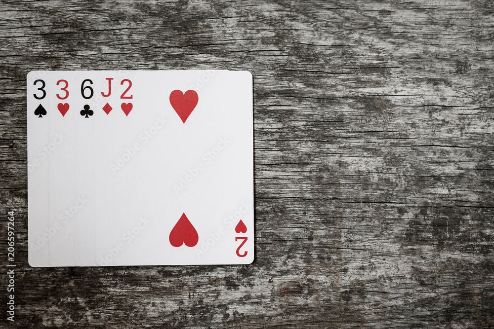 poker hand: one pair. playing cards on wooden table