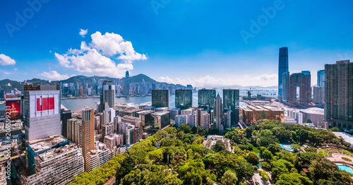 Kowloon, Hong Kong  - May 26, 2018 : City view of Kowloon peninsula and Hong Kong island at hot afternoon