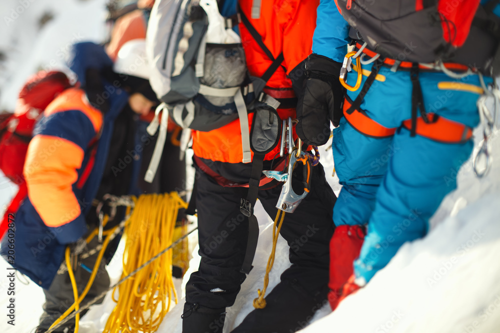 Group climbers on a snowy mountain slope. Tilt-shift effect. Group climbers on a snowy mountain slope. Tilt-shift effect.