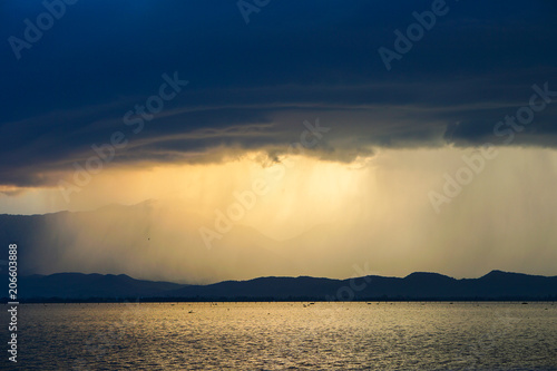 Beautiful rain storm in the Lake,with dark blue sky