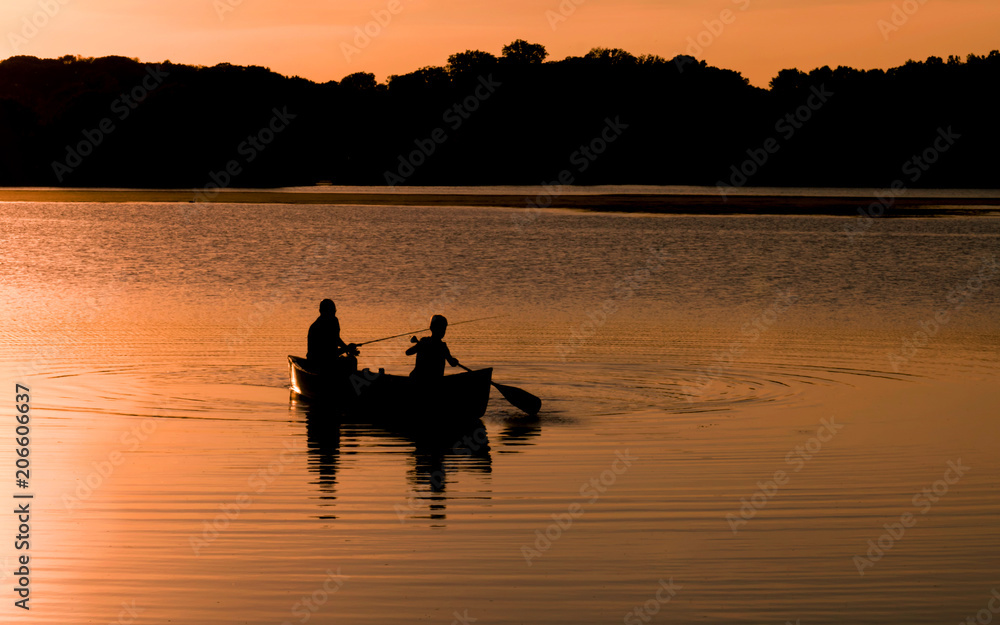 People are enjoying fishing under sunset