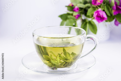A cup of mint tea isolated on white