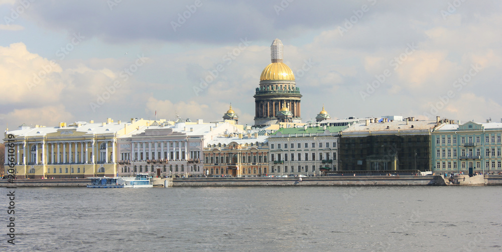 Saint Petersburg Cityscape Over Neva River on Sunset in Russia. City Skyline Colorful Photo with Historical Russian Architecture: Traditional City Drawbridge and St. Isaac's Cathedral on Background.