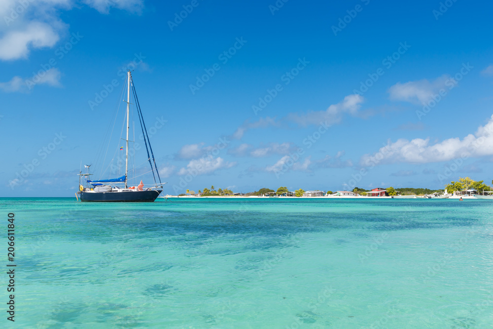 sailboat on the beautiful water of Los Roques archipelago, in Venezuela sailboat on the beautiful water of Los Roques archipelago, in Venezuela