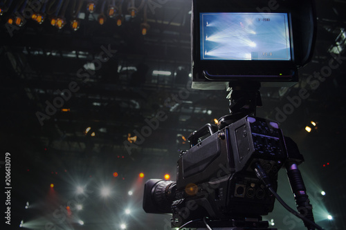 Professional digital video camera. accessories for 4k video cameras. tv camera in a concert hall.