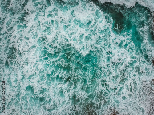 Aerial view of ocean waves and foam