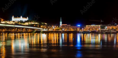 Bratislava, Slovakia May 23, 2018: Bratislava castle at night with light reflection on the dunaj river on right riverside