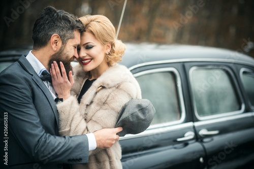 Just married couple at the black retro car on their wedding. © Volodymyr