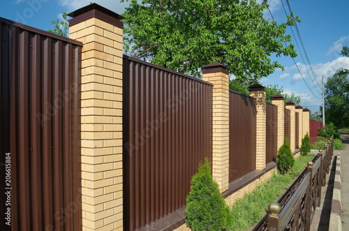 Metal profile Fence with brick pillars photo