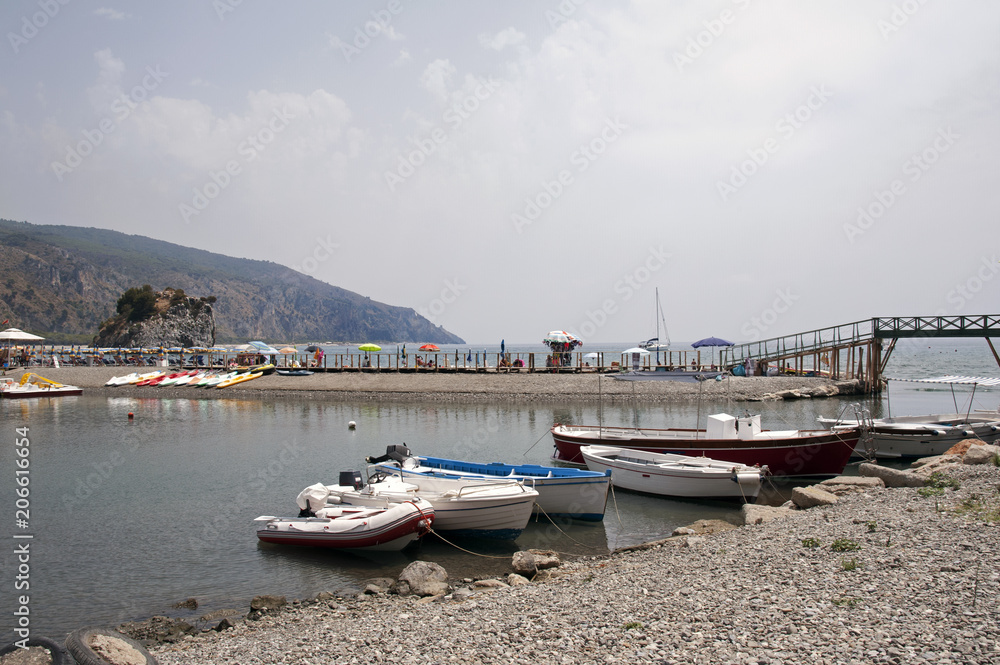 Mouth of the river with moored boats and leisure activities Mouth of the river with moored boats and leisure activities