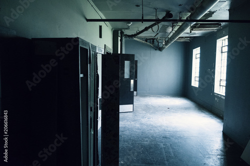 Empty abandoned institutional interior.