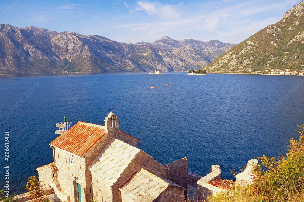 Montenegro. Beautiful autumn view of Bay of Kotor, Church of Our Lady of the Angels and two small islands (Our Lady of the Rocks and St. George)