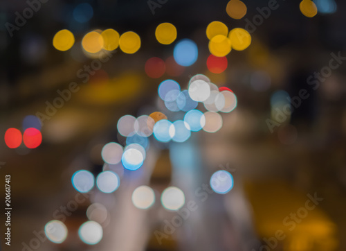 Colorful of traffic light at night. Blur road and bokeh background © Chris
