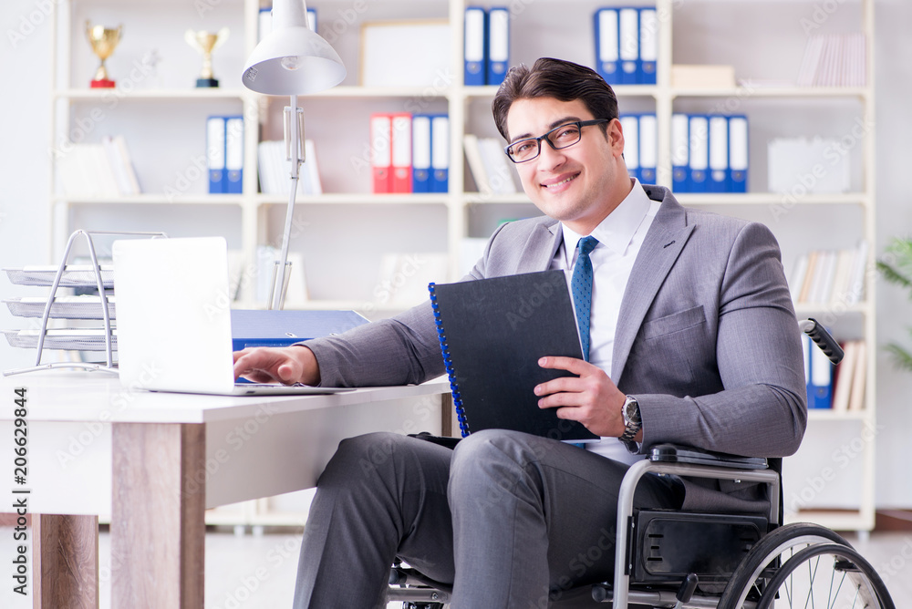 Disabled businessman working in the office Disabled businessman working in the office