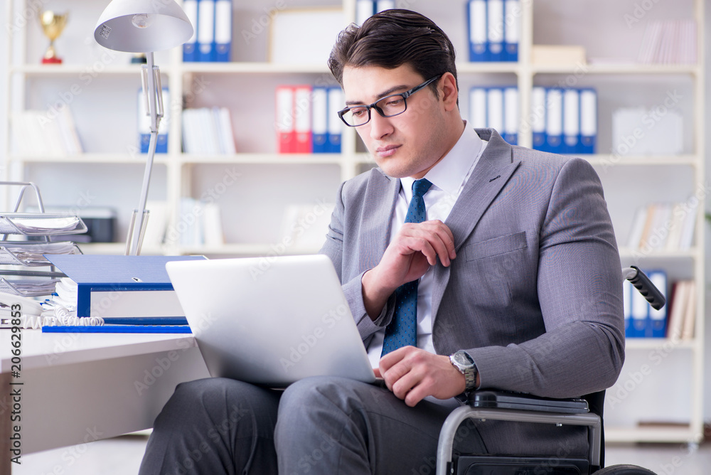 Disabled businessman working in the office Disabled businessman working in the office