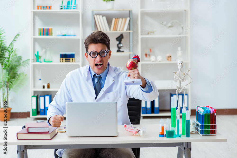 Funny doctor having fun in hospital lab Funny doctor having fun in hospital lab
