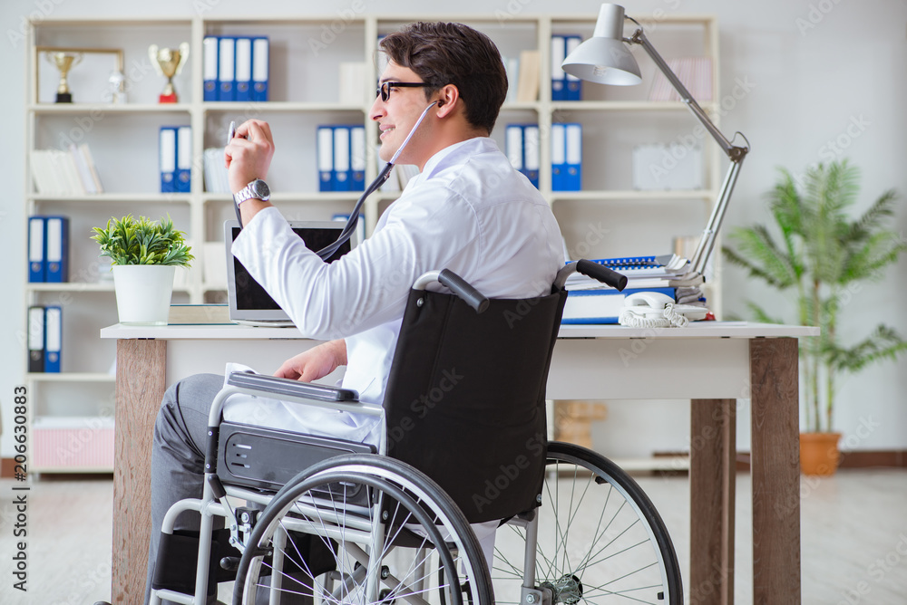 Disabled doctor on wheelchair working in hospital Disabled doctor on wheelchair working in hospital