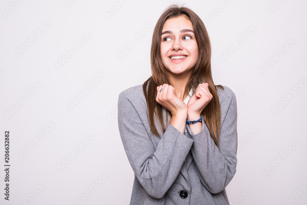 Close up portrait of happy excited young female celebrating success and promotion at work, looking at camera with broad cheerful smile, holding hands on her face, feeling joy and happiness Close up portrait of happy excited young female celebrating success and promotion at work, looking at camera with broad cheerful smile, holding hands on her face, feeling joy and happiness