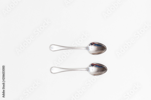 Two Coffee spoons on a white background in a studio