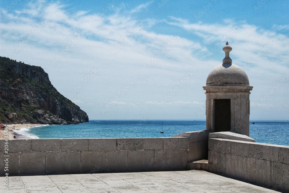 Watchtower of the fortress on the beach in Sesimbra village