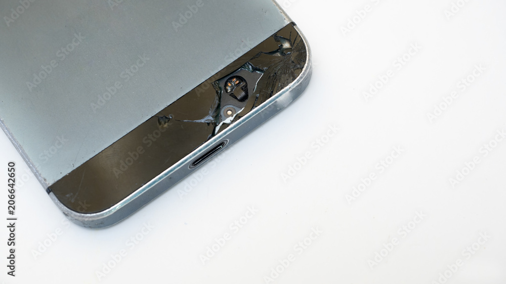 close up of black mobile phone with broken on white background. close up of black mobile phone with broken on white background.