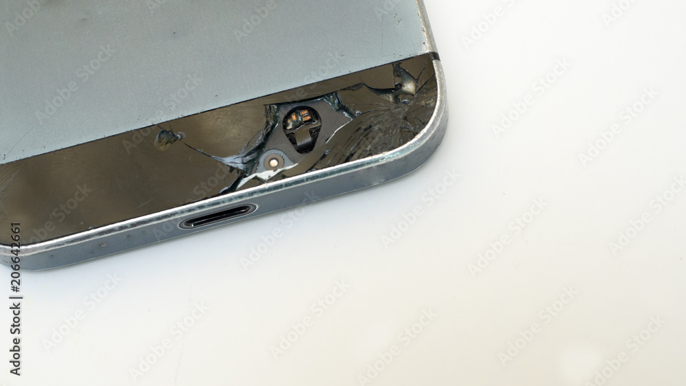 close up of black mobile phone with broken on white background. close up of black mobile phone with broken on white background.