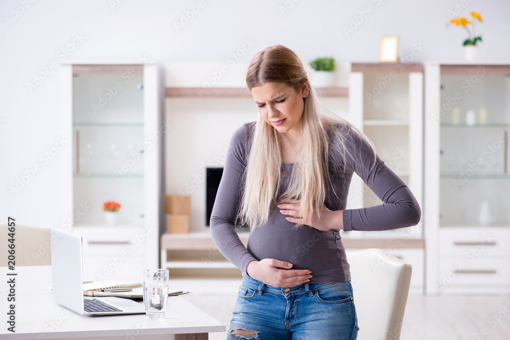 Pregnant woman at home getting ready for childbirth
