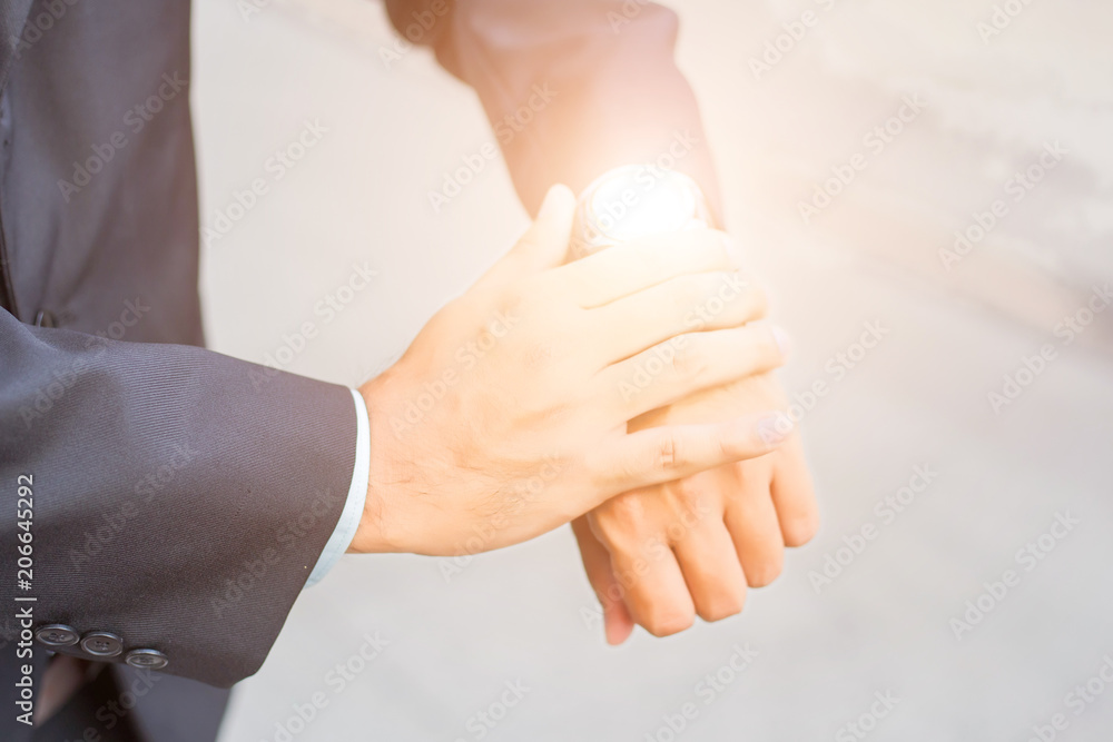 Obraz premium Young Asia handsome businessman looking at his watch