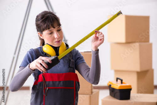 Woman contractor with measuring tape