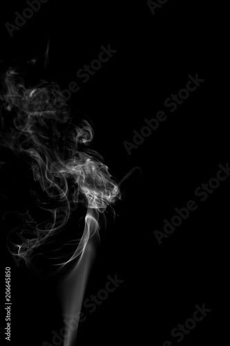 Fototapeta Naklejka Na Ścianę i Meble -  Movement of white smoke isolated on black background.