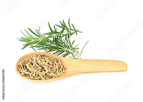 Dry Rosemary in wood spoon on white background