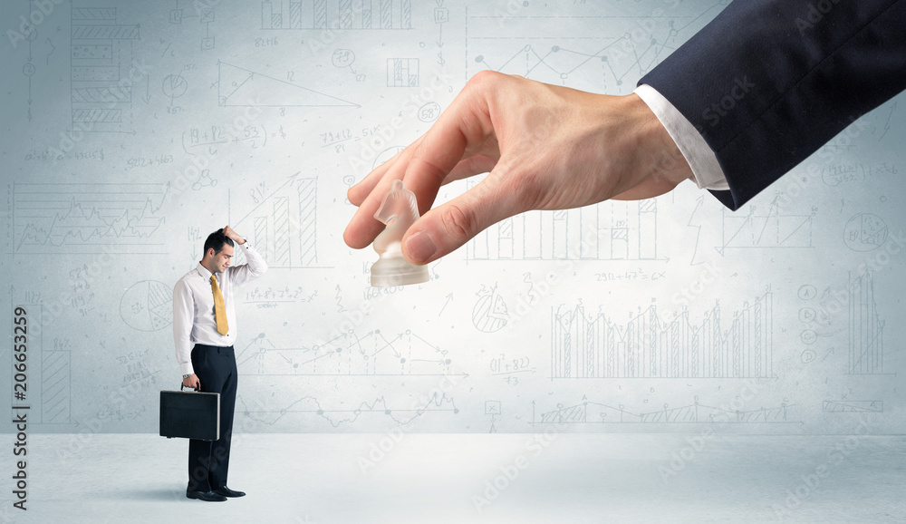 Little businessman is afraid to make the next step in his chess game with graphs, charts and reports background
Little businessman is afraid to make the next step in his chess game with graphs, charts and reports background