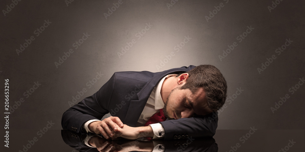 Young businessman fell asleep at his workplace with copy space Young businessman fell asleep at his workplace with copy space