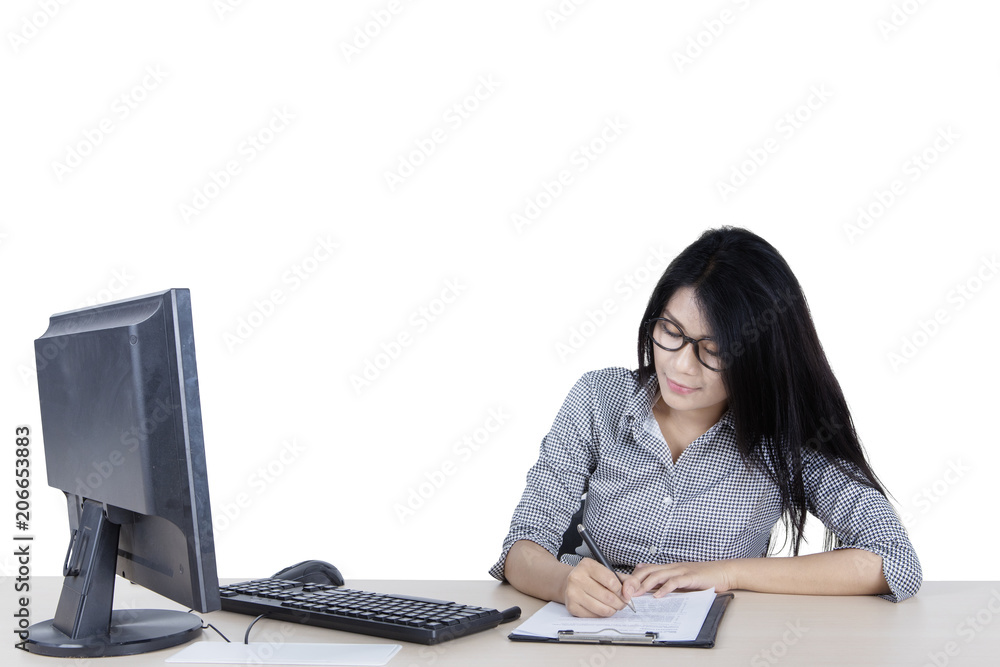 Business woman writing on the paperwork Business woman writing on the paperwork