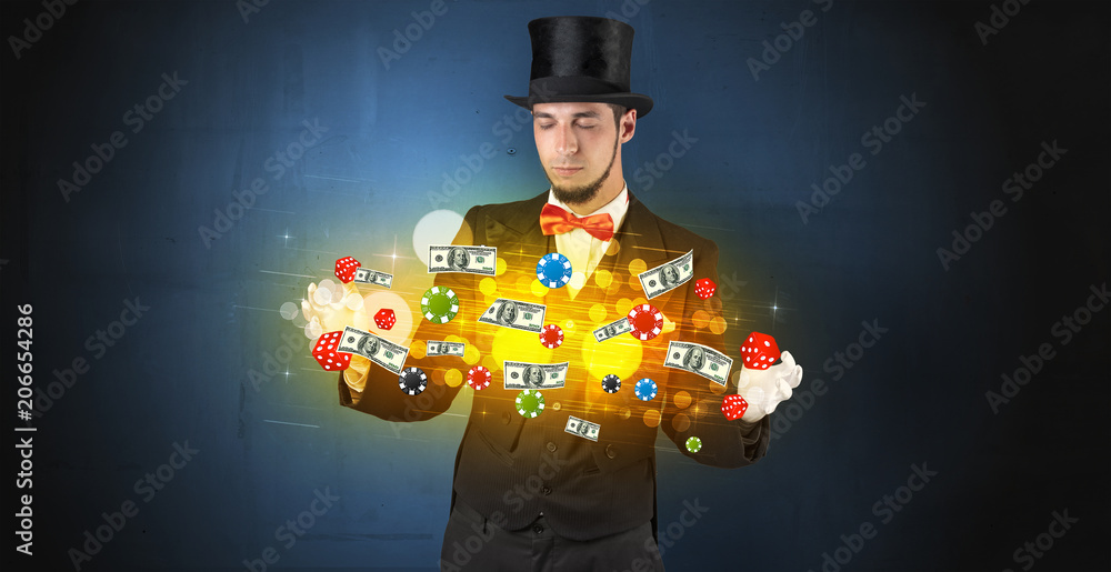 Young illusionist in tails hold between hands gambling staffs with super power Young illusionist in tails hold between hands gambling staffs with super power